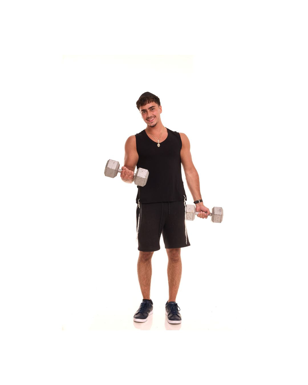 The black Le'Shem Tank worn while lifting weights, showing the sleeveless cut in motion